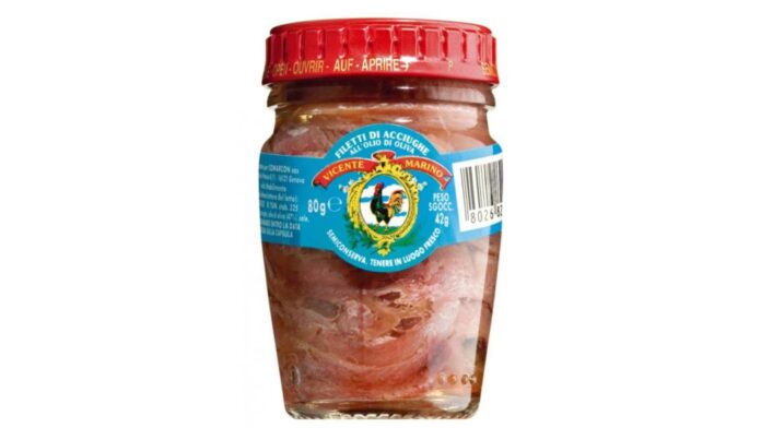 A jar of Vicente Marino brand anchovy fillets in olive oil.